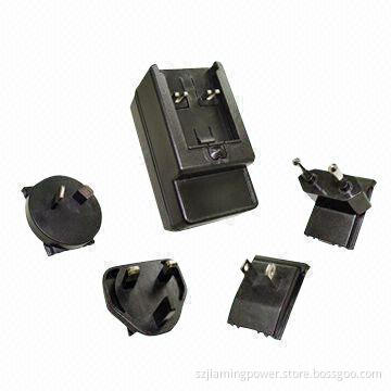 AC/DC Switching Adapter with Fixed and Interchangeable Plugs